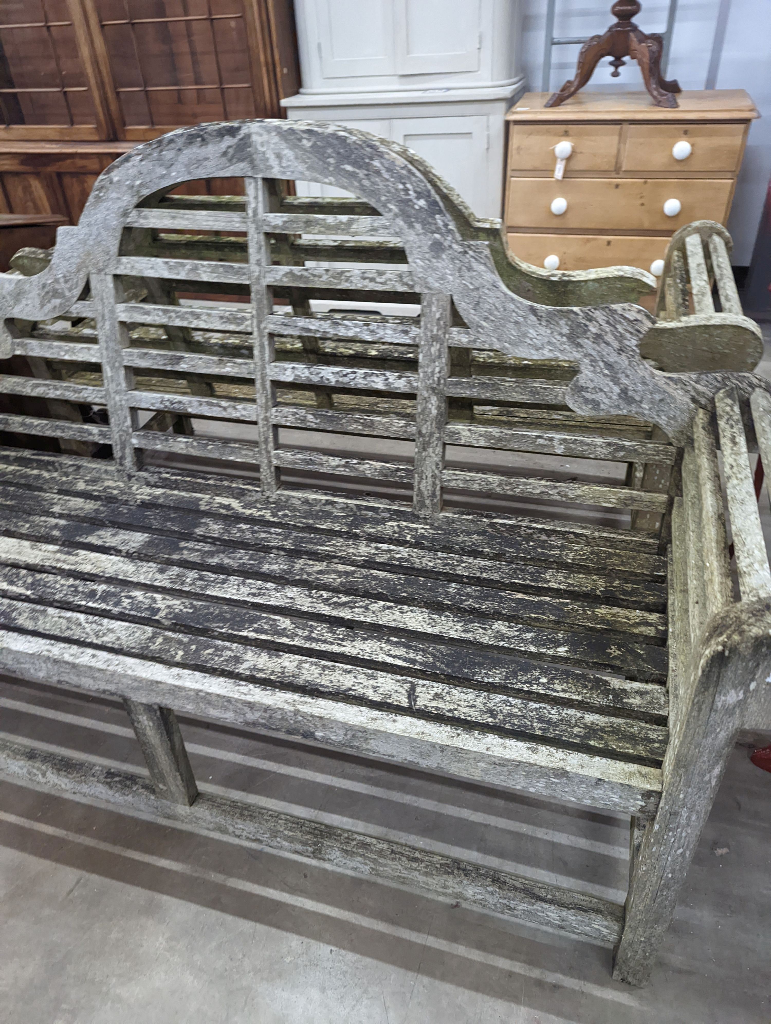 A pair of Lutyens design weathered teak garden benches, length 167cm, depth 58cm, height 104cm